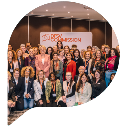 Group photo of attendees smiling at the roundtable